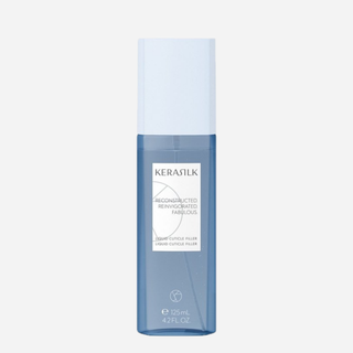 Kerasilk Liquid Cuticle Filler, 125ml flaske med hvidt låg og blå bund, styrker og genopbygger beskadiget hår ved at fylde hårstråets kutikellag.